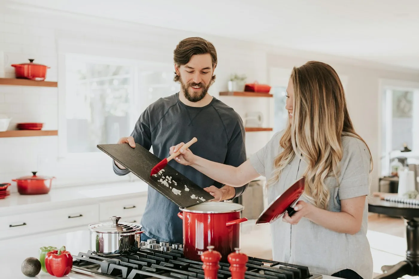 A retail employee helping a customer at the counter.